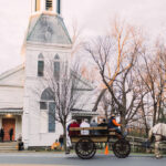 Guests arriving by horse and carriage in Vernon Center